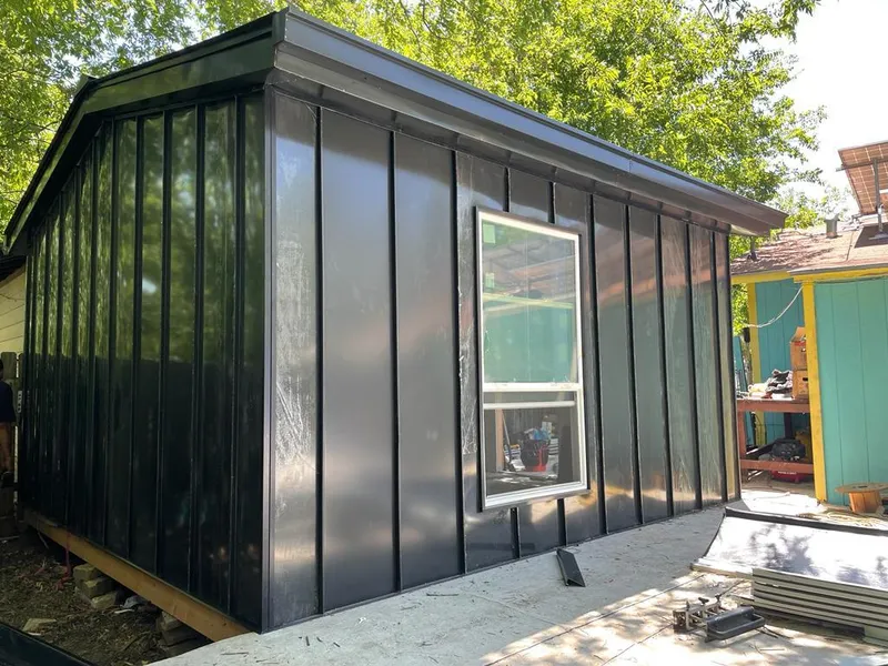 Black standing seam metal wall panels for Metal Roof Installation in Cobleskill