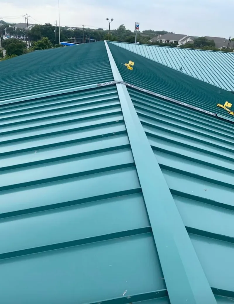 Green commercial metal roof ridge and valley for Metal Roof Repair in Cobleskill